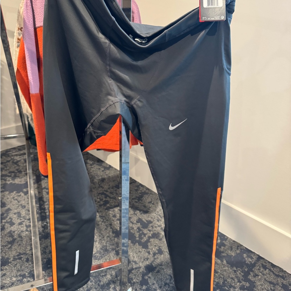 Nike Kids Leggings in Black with Orange Stripes